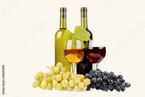 isolated wine bottle with glass and green grapes