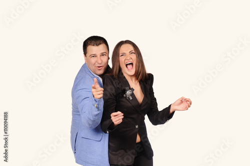 Man and woman with funny faces isolated over white background