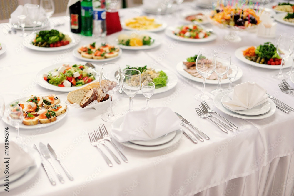 table set service with silverware and glass stemware at restaura table set service with silverware and glass stemware at restaura