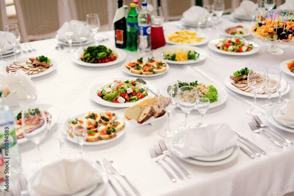 Fototapeta premium table set service with silverware and glass stemware at restaura