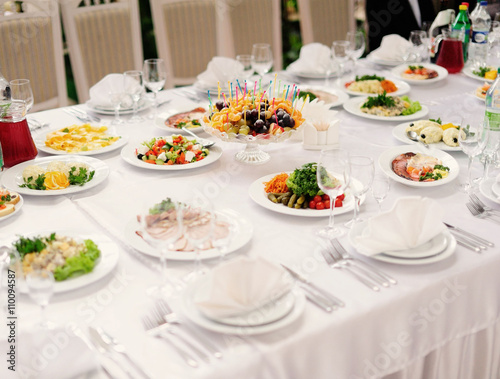 table set service with silverware and glass stemware at restaura © Art_man