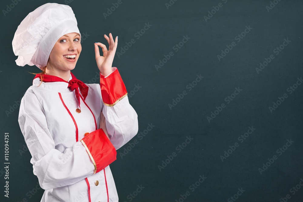 Composite image of pretty chef standing with arms crossed Composite image of pretty chef standing with arms crossed