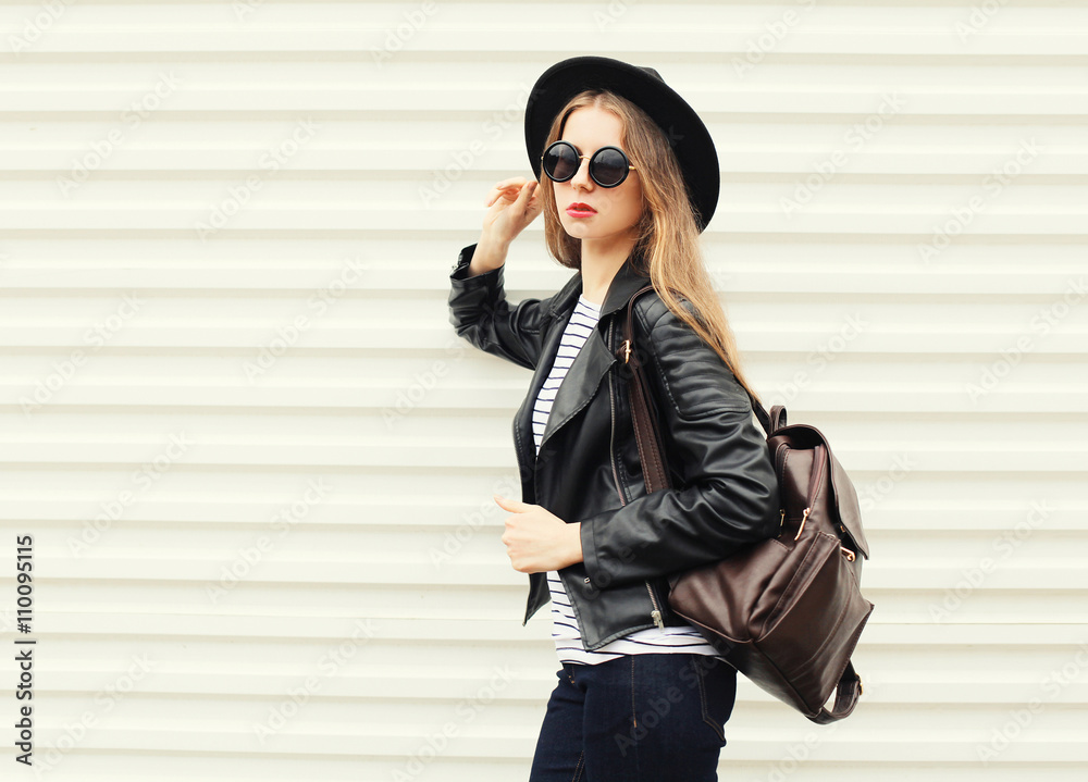 Fototapeta premium Fashion pretty cool woman in black rock style over white backgro