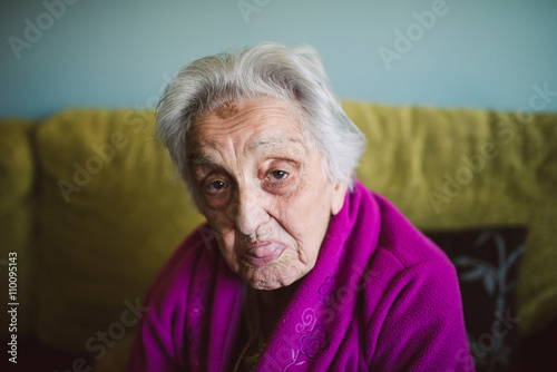 Elderly woman sticking out her tongue
