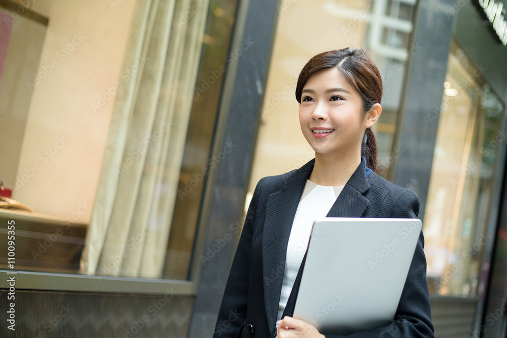 Young Businesswoman hold with notebook computer Young Businesswoman hold with notebook computer