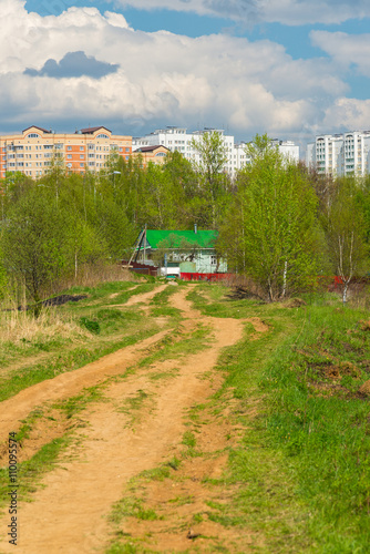Rural house on background of the city