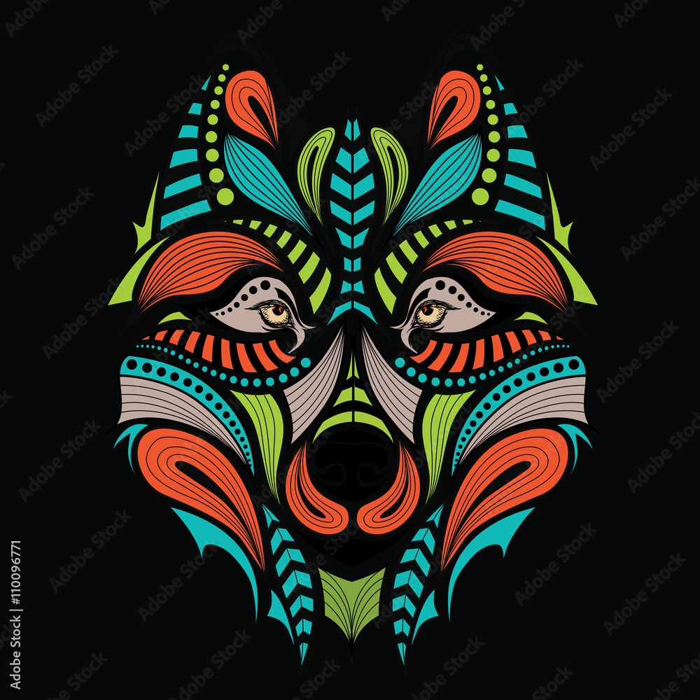 Patterned colored head of the wolf. African / indian / totem / tattoo design. It may be used for design of a t-shirt, bag, postcard and poster.