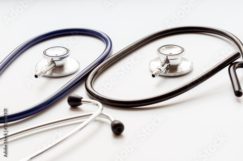 two disassembled stethoscope on white background