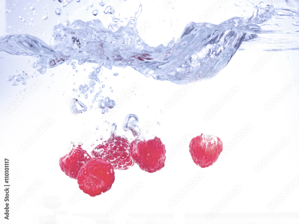 raspberries dropped in water