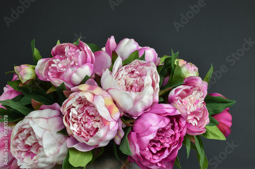 Fototapeta Naklejka Na Ścianę i Meble -  Pink bouquet peony flowers.
Dark background.