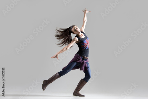 Stylish dancing young woman portrait