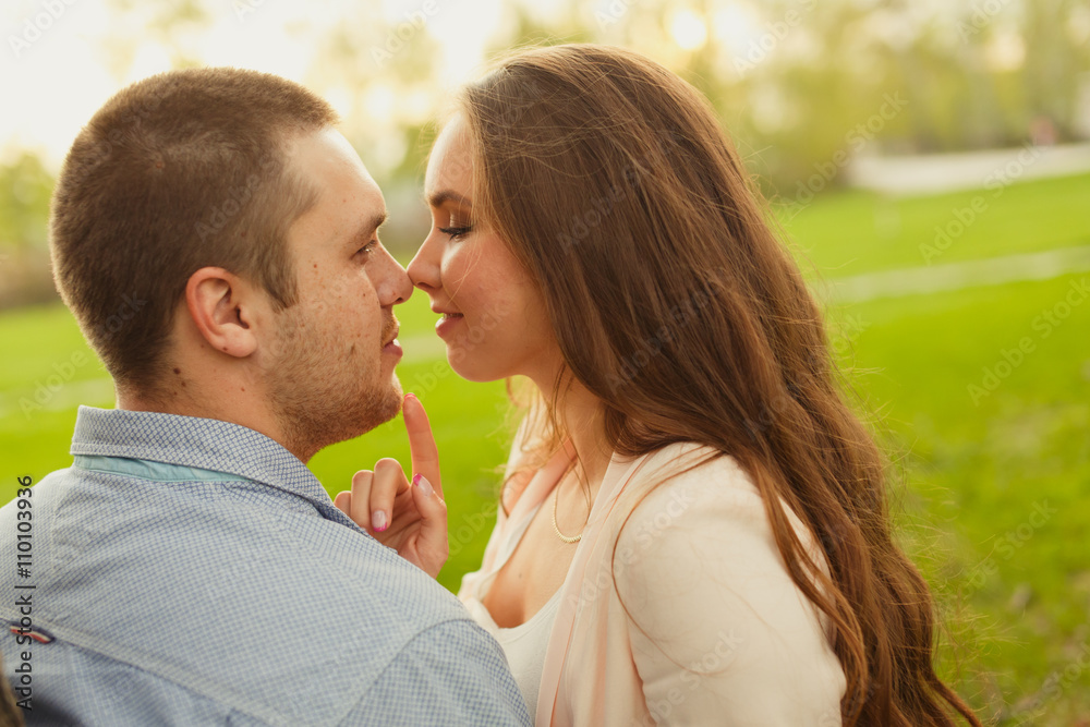 Fototapeta premium Happy Smiling Couple Relaxing on Green Grass.Park