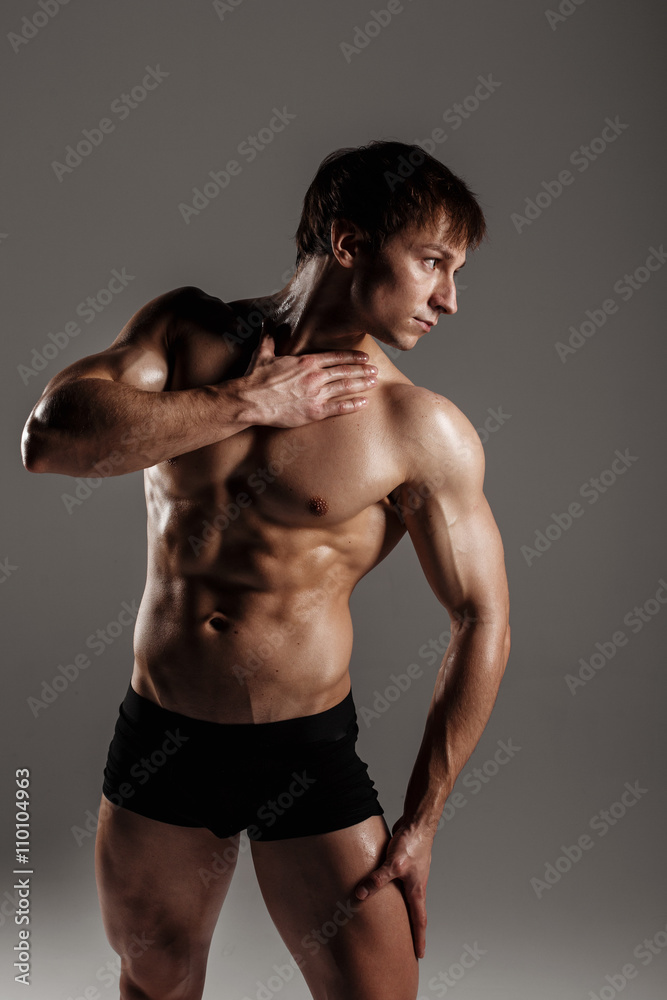 Strong Athletic Man showing muscular body and sixpack abs. Showing his  body. FITNESS MODEL. Great for Underwear Commercial. Wet body Stock-Foto |  Adobe Stock