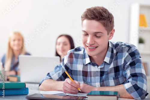 Male student studying in the class