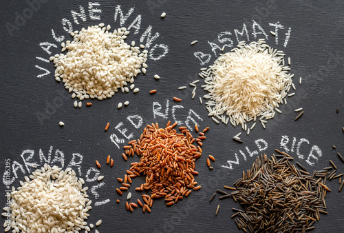 Different kinds of rice on the dark background photo