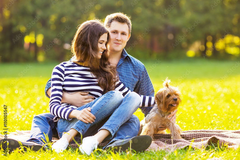 Fototapeta premium Lifestyle, happy family of two resting at a picnic in the park w