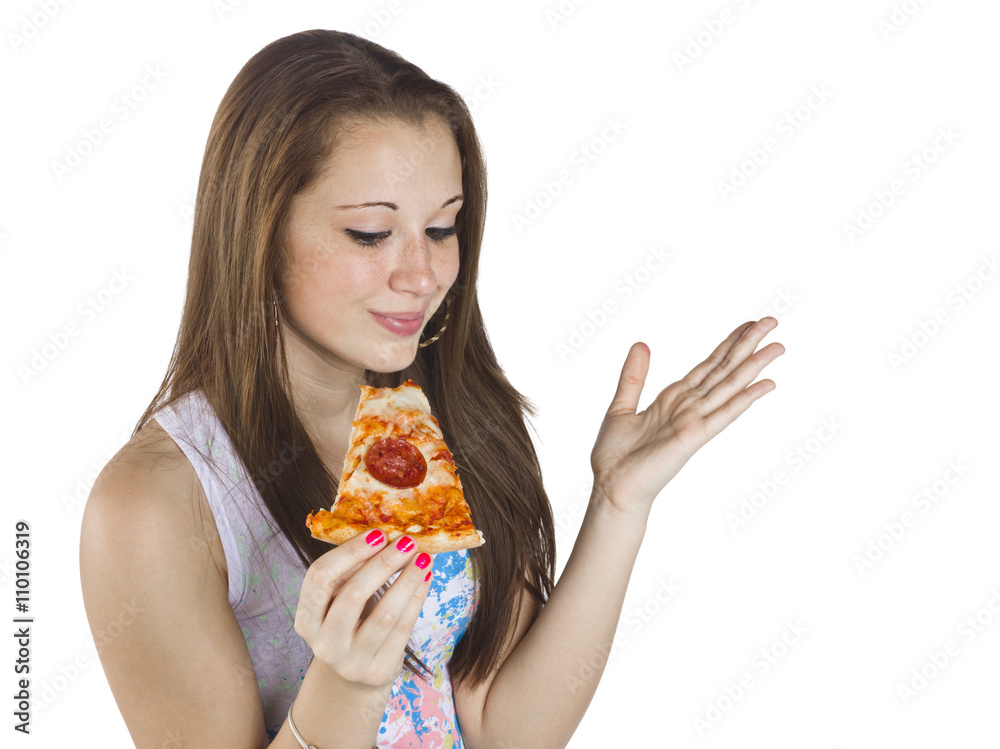 teenage girl holding a slice of pizza.