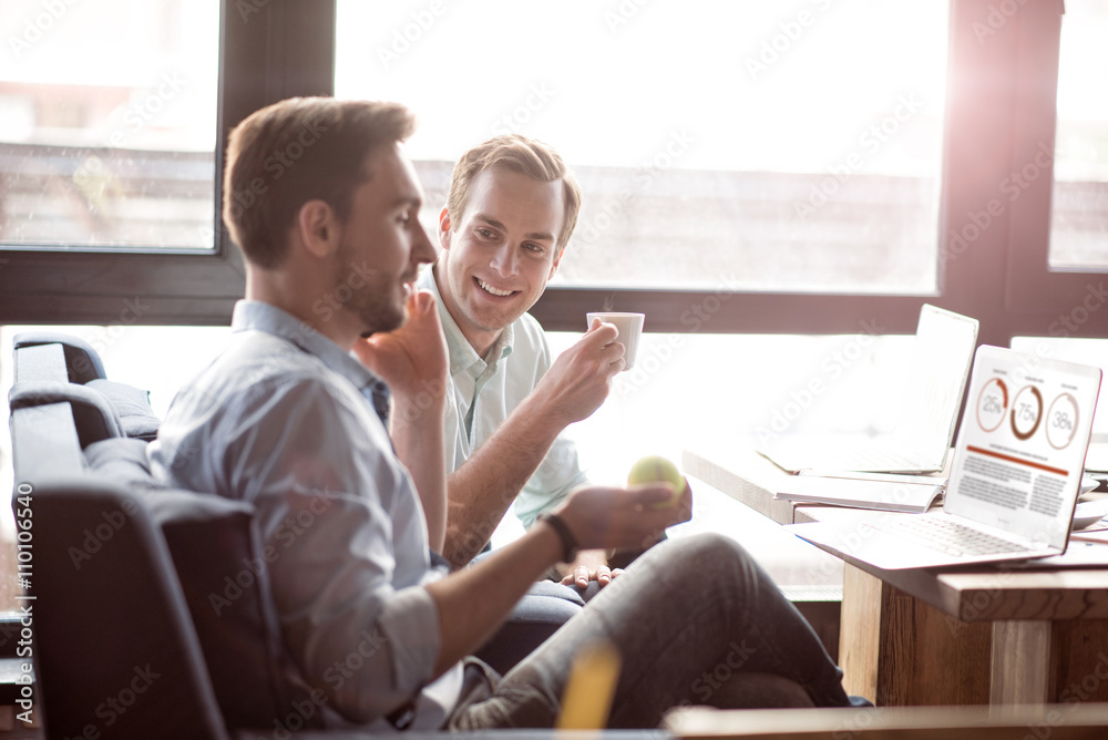 Positive colleagues sitting at the table Positive colleagues sitting at the table