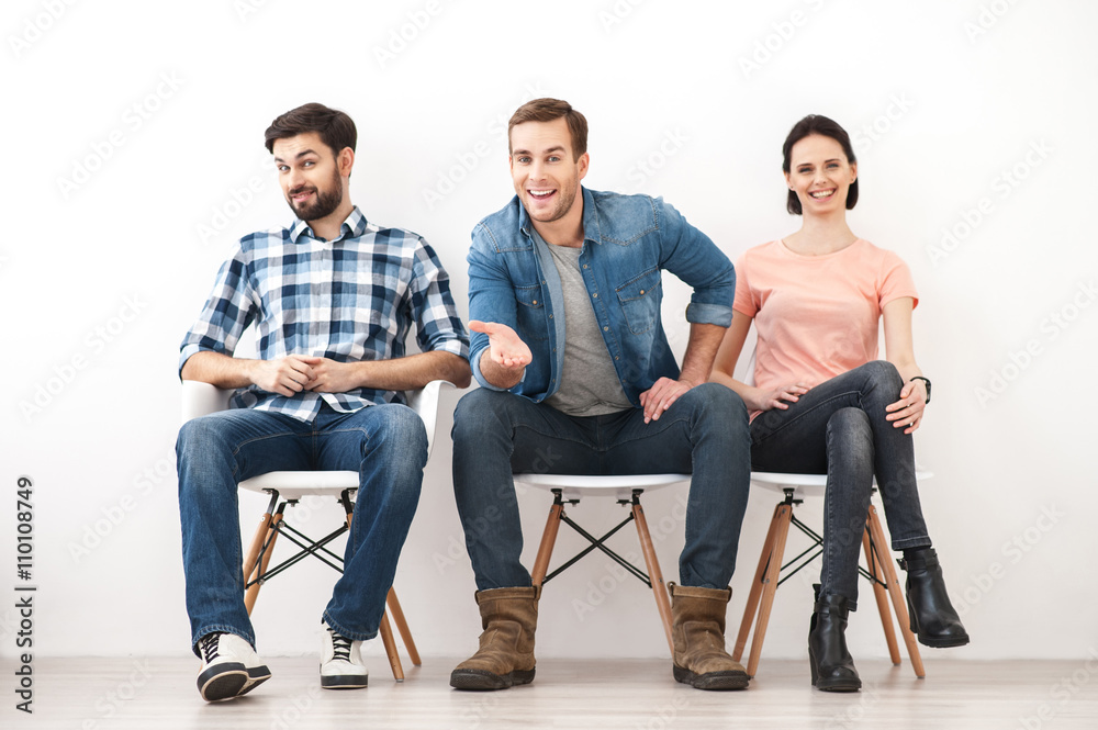 Skillful three workers are sitting with anticipation Skillful three workers are sitting with anticipation
