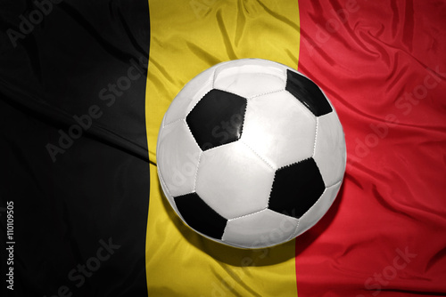 black and white football ball on the national flag of belgium