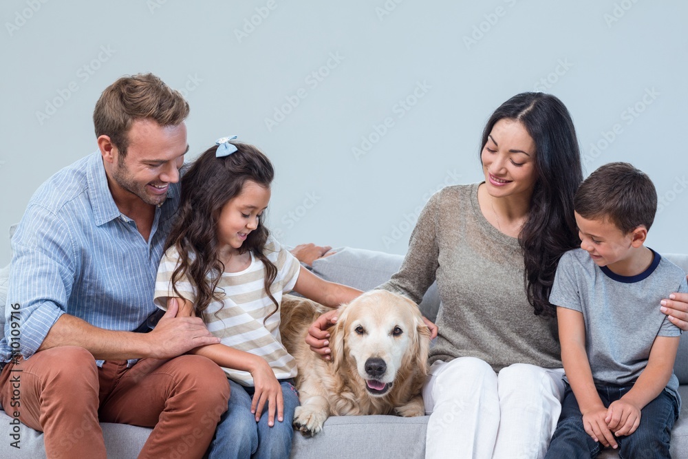 Family with dog in living room