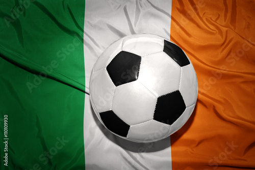 black and white football ball on the national flag of ireland