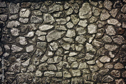 background wall built of large stones closeup