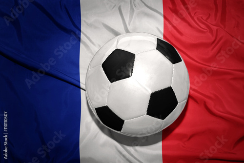 black and white football ball on the national flag of france