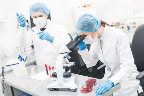 Professional scientists are doing research in laboratory