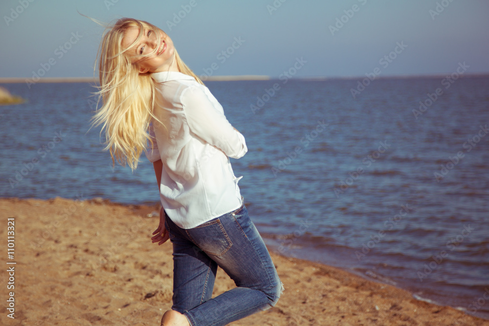 Happy beautiful woman enjoying summer and sum at the sea Happy beautiful woman enjoying summer and sum at the sea