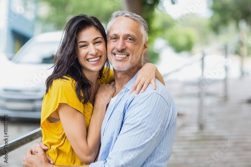 Portrait of happy couple hugging