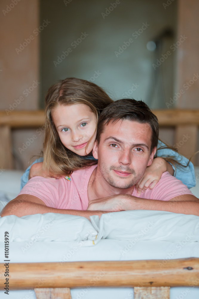 Father and adorable little girl having fun at home Father and adorable little girl having fun at home