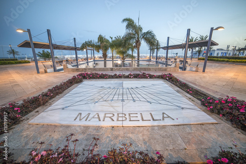 Marbella sun clock at dusk.