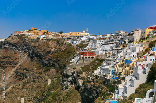 Fira, modern capital of the Greek Aegean island, Santorini, in the sunny day, Greece © Kavalenkava