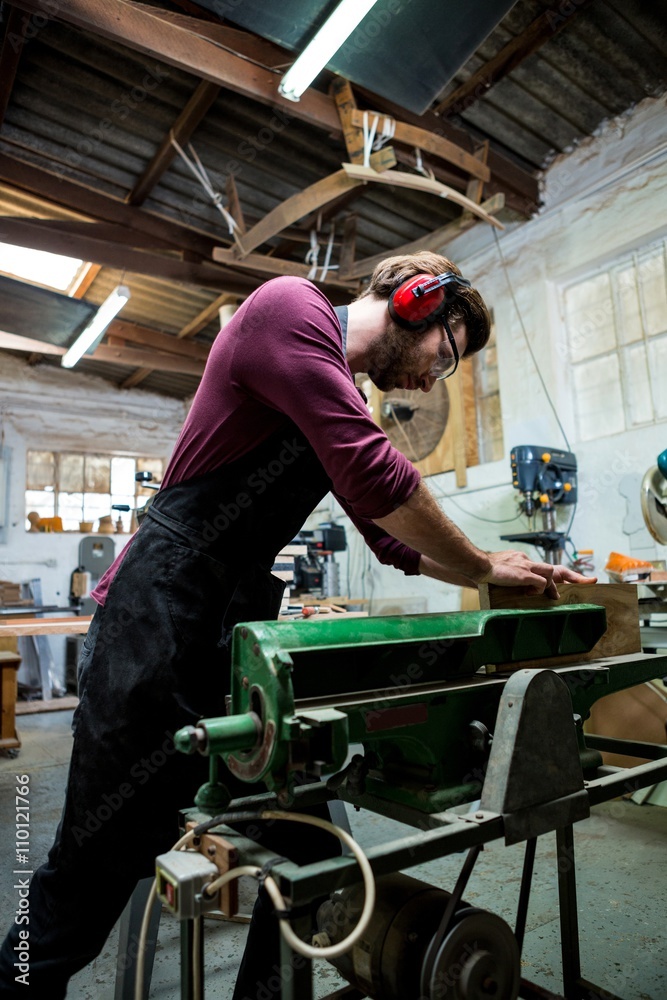 Fototapeta premium Carpenter working on his craft