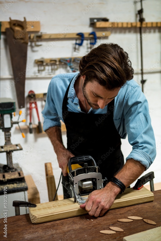 Carpenter working on his craft Carpenter working on his craft