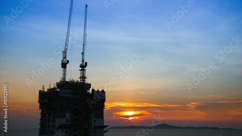 construction near the beach at sunset, time lapse