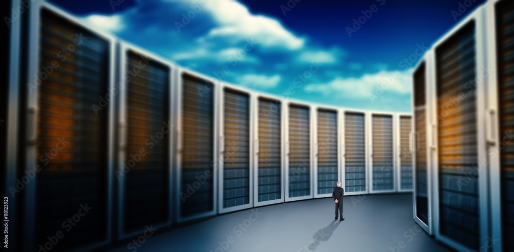 Fototapeta premium Composite image of rear view of mature businessman posing