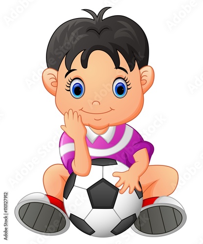 Cute boy holding a soccer ball