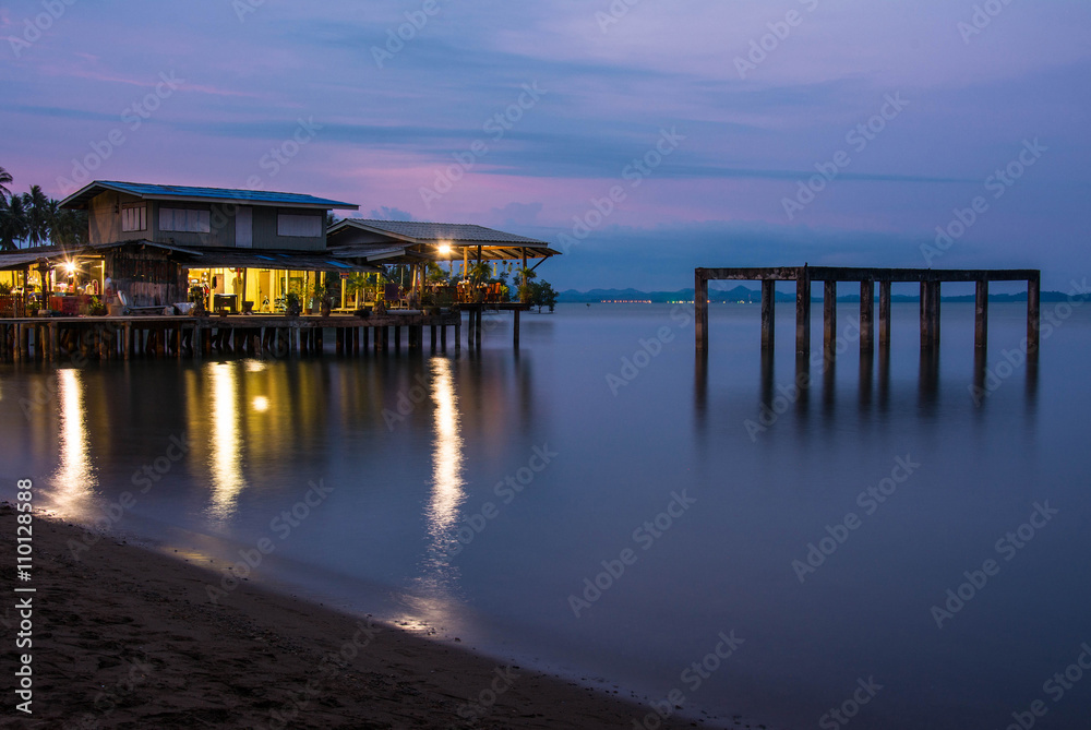 house on the beach with sunset over the sea on koh chang island, Thailand