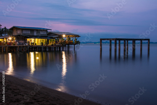 house on the beach with sunset over the sea on koh chang island, Thailand © Suwatchai