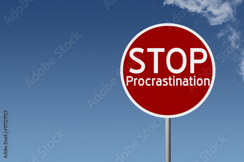 Round highway road sign with text stop procrastination