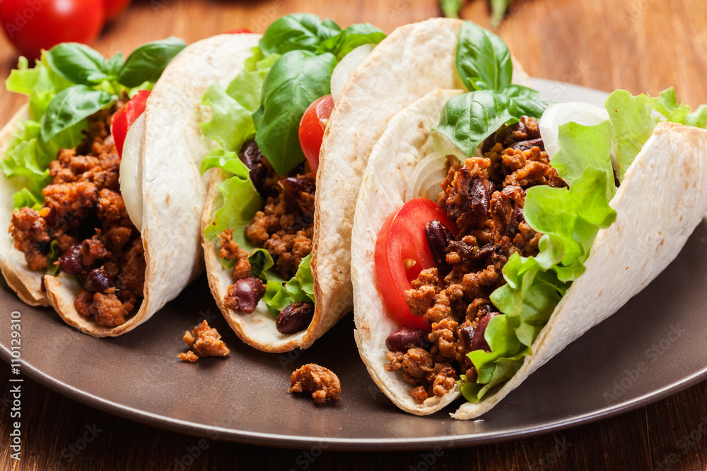 Mexican tacos with minced meat, beans and spices Mexican tacos with minced meat, beans and spices