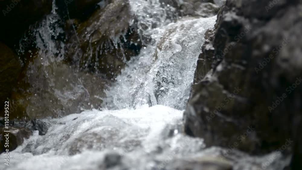 Pure fresh water waterfall in forest in the mountains