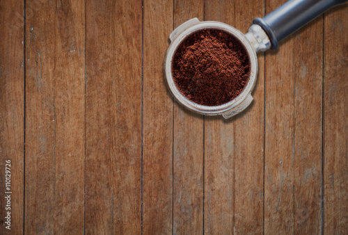 Coffee grind in group on wooden background