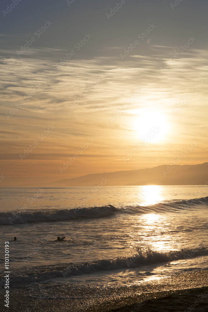 The Pacific ocean during sunset. Landscape with blue sea, the mountains and the dusk sky, the USA, Santa Monica.