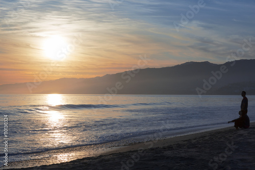 The Pacific ocean during sunset. Landscape with blue sea, the mountains and the dusk sky, the USA, Santa Monica.