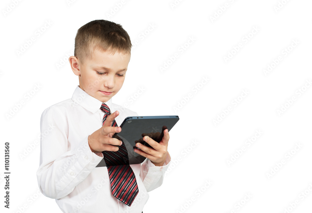 Portrait of little school boy using tablet pc. Education. White background Isolated Portrait of little school boy using tablet pc. Education. White background Isolated