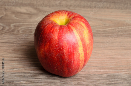 Red apple on wood
