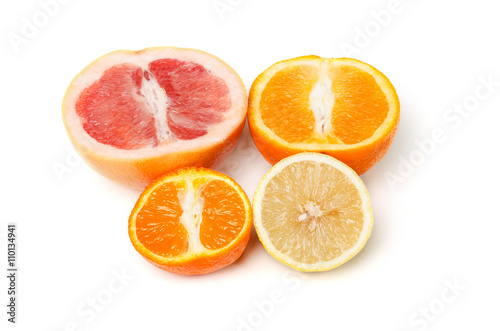 Halfes of grapefruit  orange  lemon and mandarin isolated on white